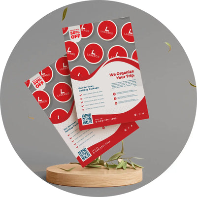 Red and white promotional flyers with circular design elements displayed on a wooden stand.